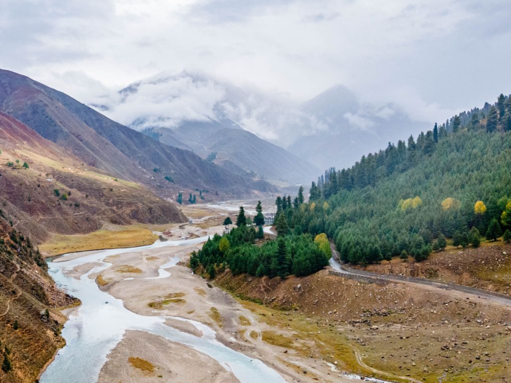 Kasol riverside view with Parvati River flowing through pine forests